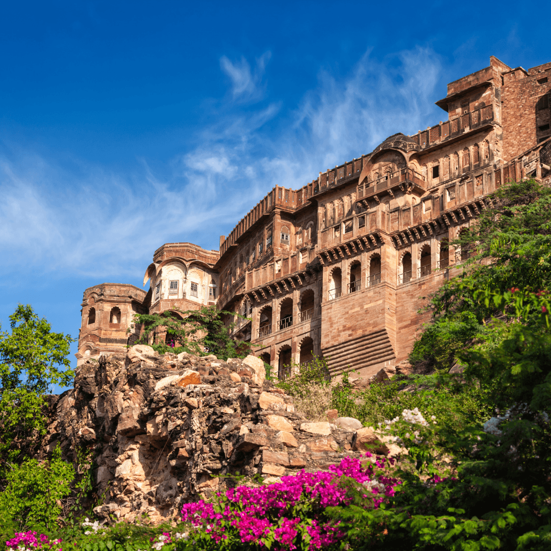 Admire the regal splendor of Mehrangarh Fort in Jodhpur, perched high above the blue city, offering breathtaking views and a glimpse into royal life with its museums and intricate architecture.