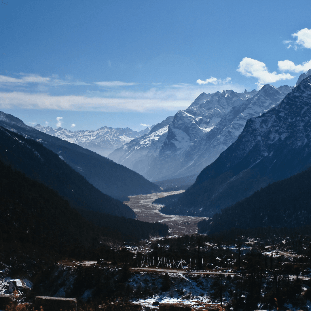 Explore the Yumthang Valley, renowned as the 'Valley of Flowers'. This floral paradise offers a vibrant display of rhododendrons and other alpine flowers set against the backdrop of towering mountains.