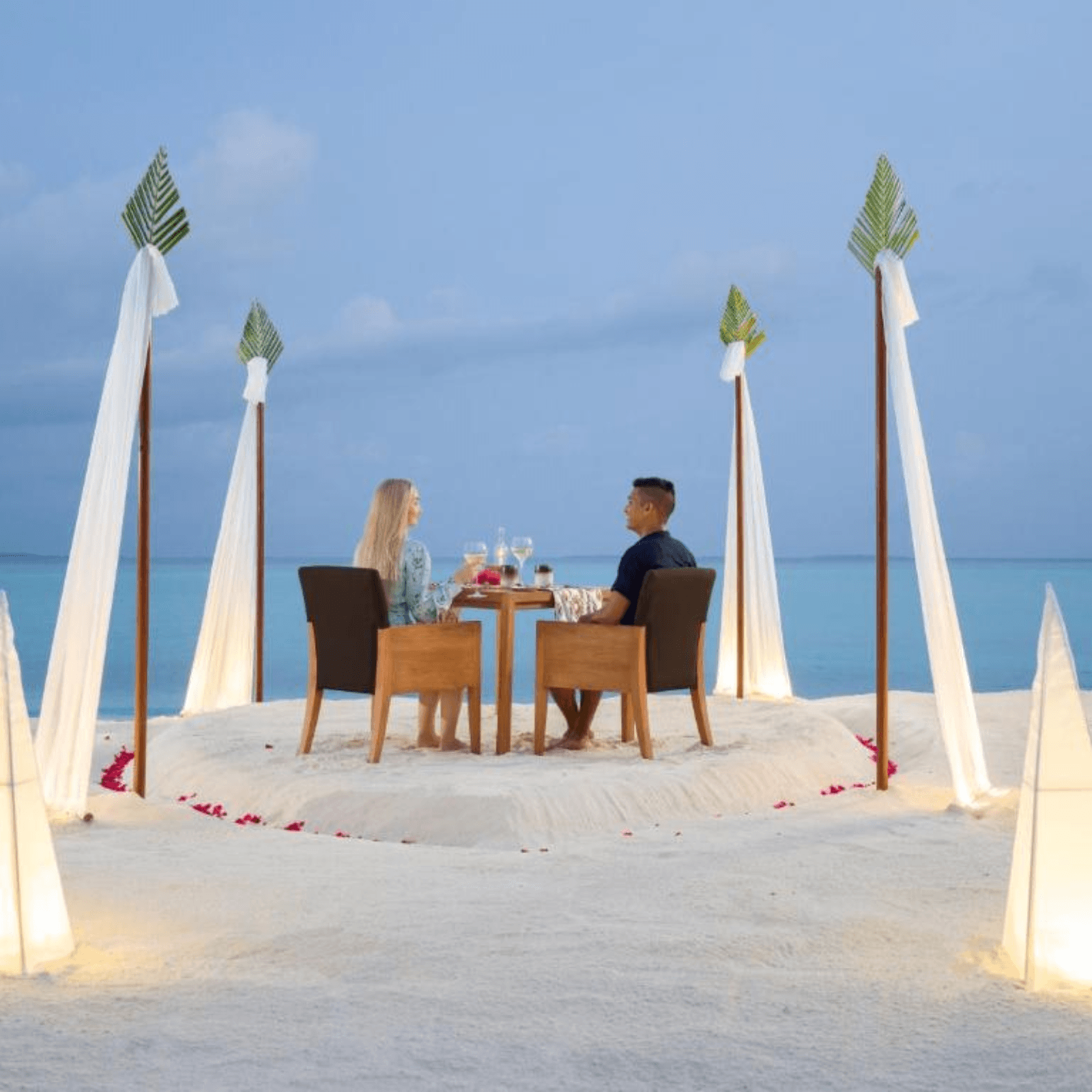 Experience a romantic candlelight dinner on a private beach.