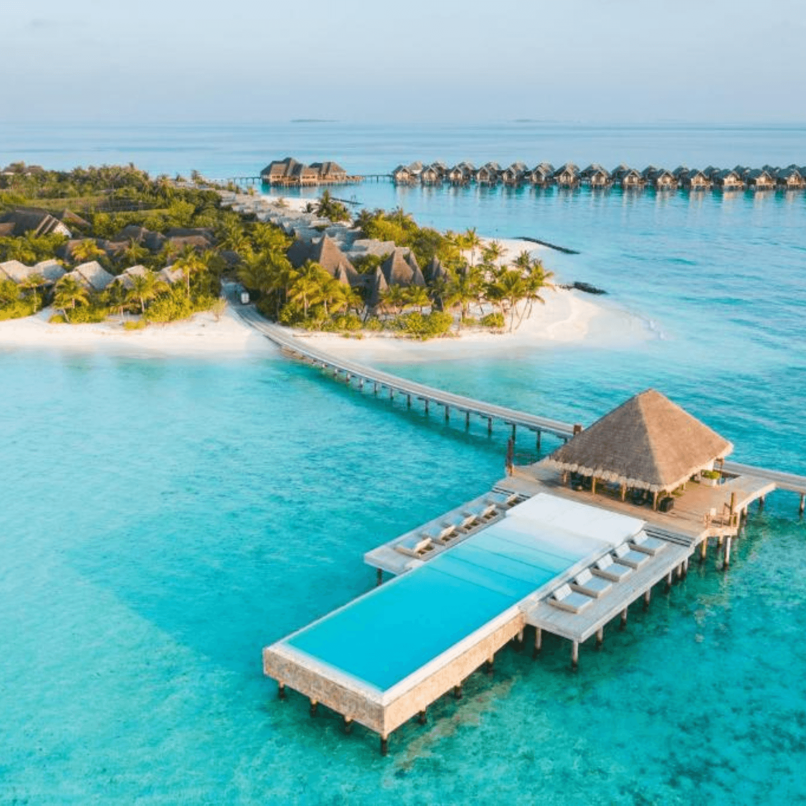 Stay in a luxurious overwater villa with spectacular ocean views.